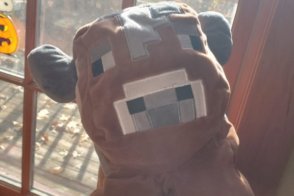 Henry, a brown Minecraft cow plush with square gray spots and a sweet looking face.